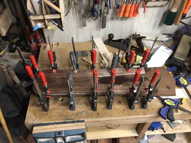Soundbox glue-up. You can never have too many clamps. I didn't have enough to glue on the top bit of maple, but that's fine because I also forgot to drill the holes for the tuning pegs.